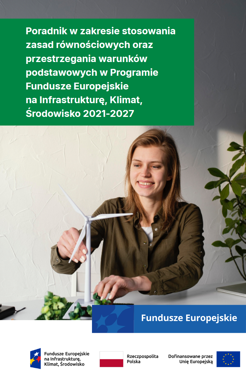 Dziewczyna trzyma w ręku miniaturową turbinę wiatrową.